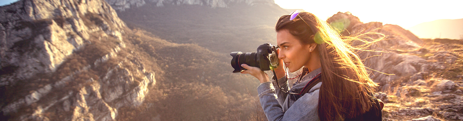 woman photographing canyons